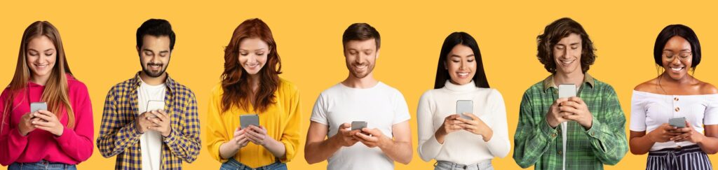 Multiracial students with mobile phones, addicted to social media, overusing technologies for